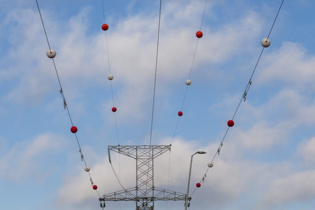 Because there are large colored balls attached to high voltage electrical cables