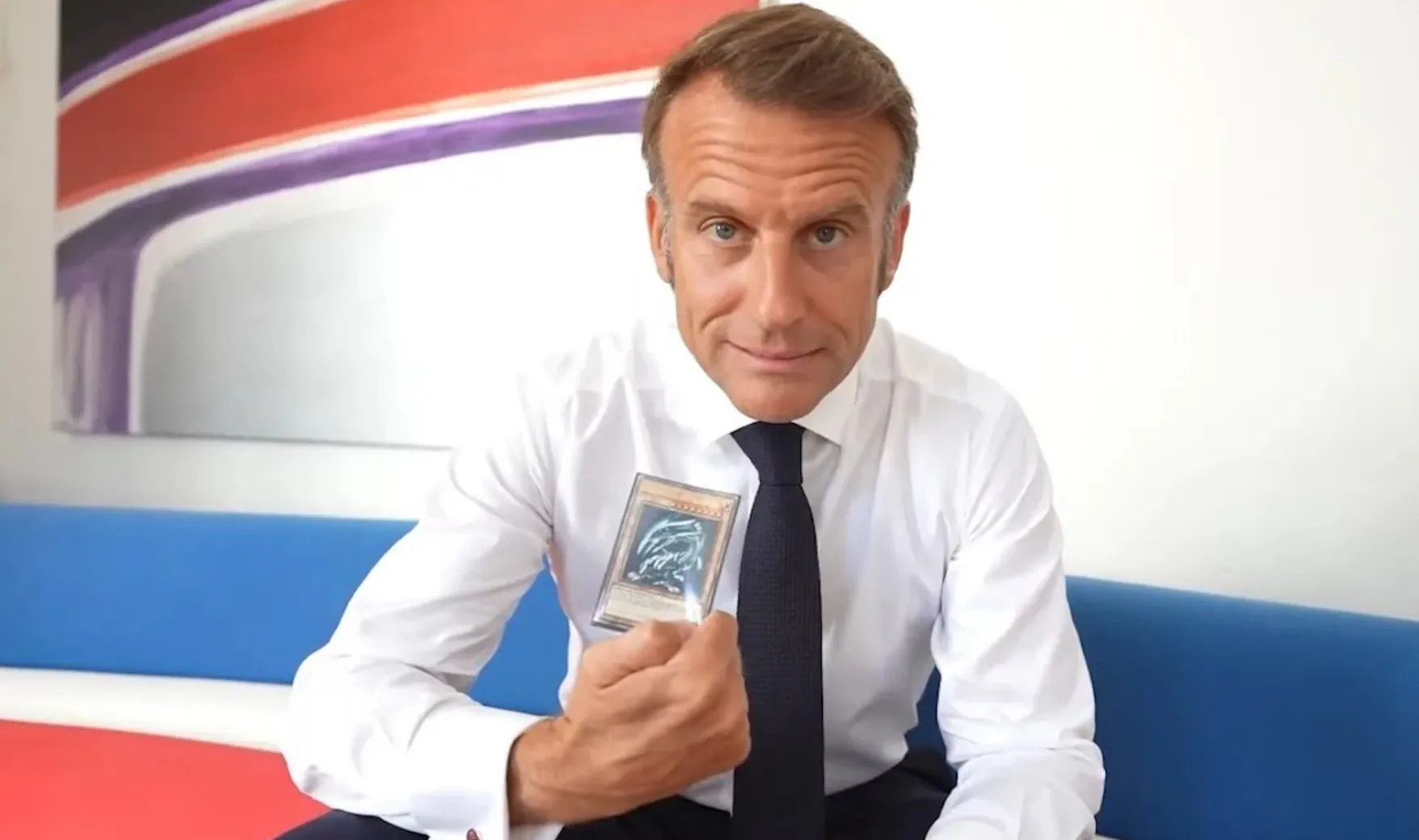 EMMANUEL MACRON | Pictured here with the card given to him by Konami for Yu–Gi–Oh! World Championship 2025.